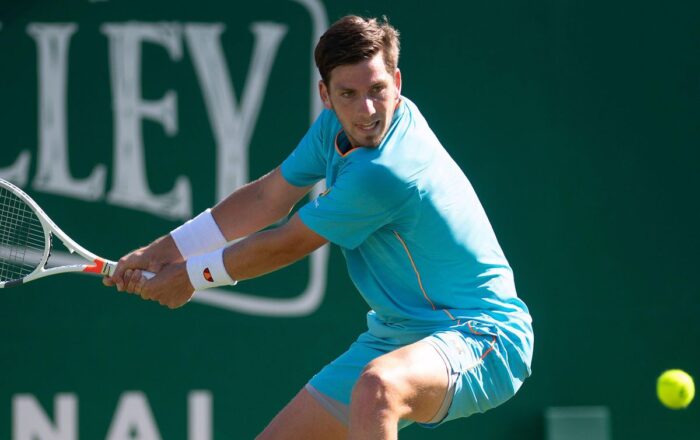 Cameron Norrie stretching to play a backhand