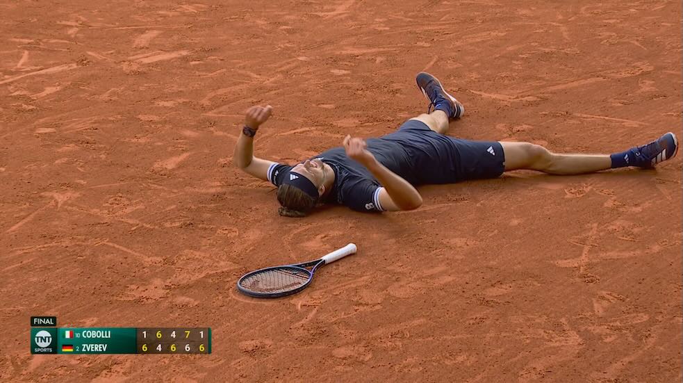 Alexander Zverev collapses on the Roland-Garros clay after winning the 2026 French Open final against Flavio Cobolli